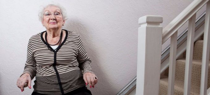 Elderly lady on a stairlift