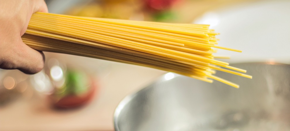 person cooking spaghetti